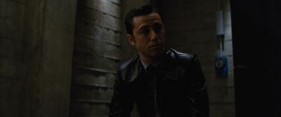 Still from Looper (2012) that has been tagged with: day & medium shot & clean single & interior & low-angle