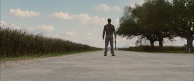 Still from Looper (2012) that has been tagged with: 92a3b0 & day & cornfield & clean single & exterior
