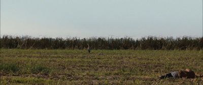 Still from Looper (2012) that has been tagged with: 4d5421 & dead body