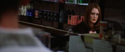 Still from Magnolia (1999) that has been tagged with: night & pharmacy & over-the-shoulder