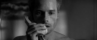 Still from Memento (2000) that has been tagged with: clean single & day & black and white & close-up