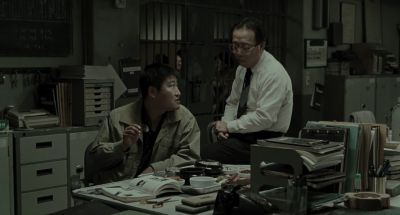 Still from Memories of Murder (2003) that has been tagged with: 625047 & day & medium wide & office