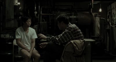 Still from Memories of Murder (2003) that has been tagged with: medium wide & night & bare bulb