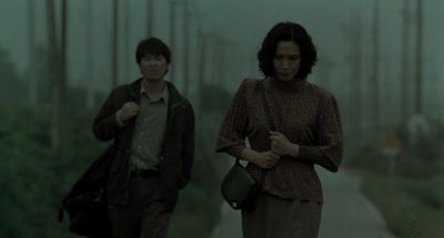 Still from Memories of Murder (2003) that has been tagged with: stalking & medium wide & countryside