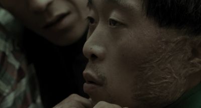 Still from Memories of Murder (2003) that has been tagged with: profile shot & close-up
