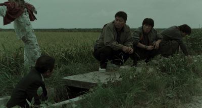 Still from Memories of Murder (2003) that has been tagged with: squatting & group-shot