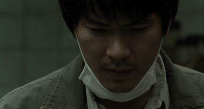 Still from Memories of Murder (2003) that has been tagged with: mask & clean single & morgue & close-up