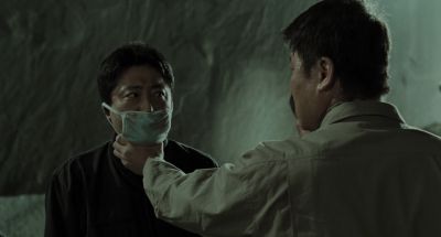 Still from Memories of Murder (2003) that has been tagged with: over-the-shoulder & night & two-shot & exterior & choking