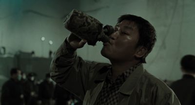 Still from Memories of Murder (2003) that has been tagged with: night & exterior & clean single & drinking & medium shot