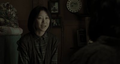 Still from Memories of Murder (2003) that has been tagged with: over-the-shoulder & interior & medium shot & day