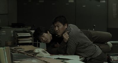 Still from Memories of Murder (2003) that has been tagged with: fight & night & over-the-shoulder