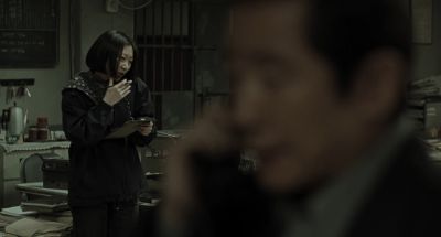 Still from Memories of Murder (2003) that has been tagged with: phone & over-the-shoulder & interior & two-shot