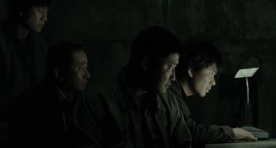 Still from Memories of Murder (2003) that has been tagged with: group-shot & night & profile shot