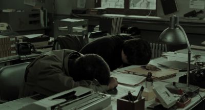 Still from Memories of Murder (2003) that has been tagged with: office & laying down