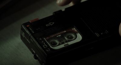 Still from Memories of Murder (2003) that has been tagged with: 0f0f0f & cassette recorder