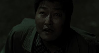 Still from Memories of Murder (2003) that has been tagged with: looking up & medium close-up & night