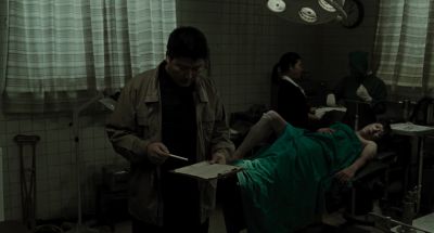 Still from Memories of Murder (2003) that has been tagged with: day & group-shot & surgery