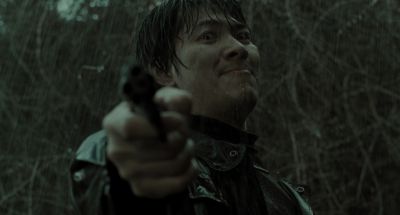 Still from Memories of Murder (2003) that has been tagged with: rain & medium close-up & gun