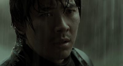 Still from Memories of Murder (2003) that has been tagged with: exterior & rain & close-up