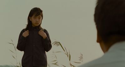 Still from Memories of Murder (2003) that has been tagged with: over-the-shoulder & medium wide & two-shot & day