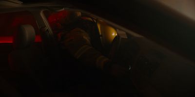 Still from Midsommar (2019) that has been tagged with: night & medium shot & car interior & fireman