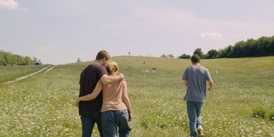 Still from Midsommar (2019) that has been tagged with: day & field & three-shot