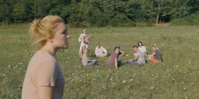 Still from Midsommar (2019) that has been tagged with: day & accordion & group-shot
