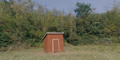 Still from Midsommar (2019) that has been tagged with: outhouse & establishing shot