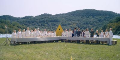 Still from Midsommar (2019) that has been tagged with: table & group-shot