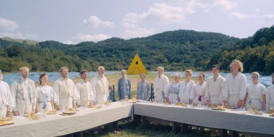 Still from Midsommar (2019) that has been tagged with: day & group-shot & banquet & exterior
