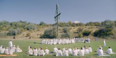 Still from Midsommar (2019) that has been tagged with: e5ab71 & extreme wide & over-the-shoulder