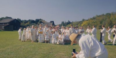 Still from Midsommar (2019) that has been tagged with: exterior & photographer & wide shot