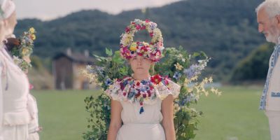 Still from Midsommar (2019) that has been tagged with: medium wide & day & three-shot