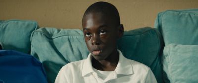 Still from Moonlight (2016) that has been tagged with: day & interior & medium close-up & couch