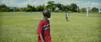 Still from Moonlight (2016) that has been tagged with: 6b8f24 & football field & over-the-shoulder