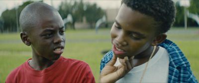 Still from Moonlight (2016) that has been tagged with: 6e1c1c & two-shot
