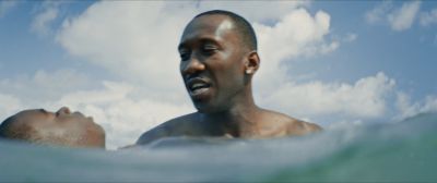 Still from Moonlight (2016) that has been tagged with: medium close-up & ocean