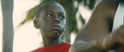 Still from Moonlight (2016) that has been tagged with: 714f38 & close-up & low-angle & day