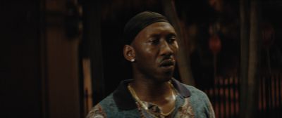 Still from Moonlight (2016) that has been tagged with: 714f38 & clean single & night & medium close-up