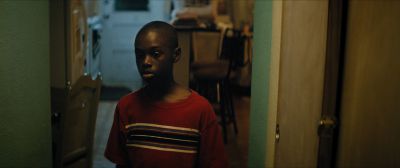 Still from Moonlight (2016) that has been tagged with: 714f38 & medium wide & night & doorway