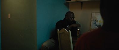 Still from Moonlight (2016) that has been tagged with: 002147 & interior & over-the-shoulder & medium wide