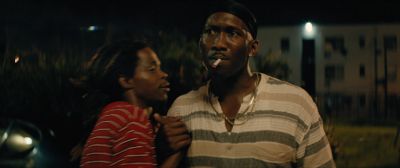 Still from Moonlight (2016) that has been tagged with: two-shot & clean single & medium shot & night & exterior