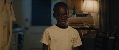 Still from Moonlight (2016) that has been tagged with: medium close-up & clean single & interior & kitchen & practical lamp