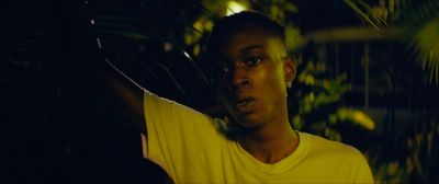 Still from Moonlight (2016) that has been tagged with: 808000 & medium close-up & night