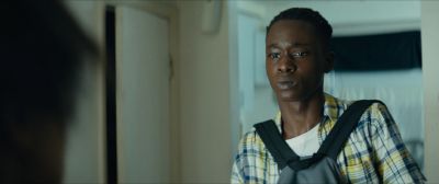 Still from Moonlight (2016) that has been tagged with: 6b8f24 & medium shot & day & over-the-shoulder