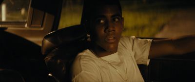 Still from Moonlight (2016) that has been tagged with: 6c551e & night & interior & medium close-up