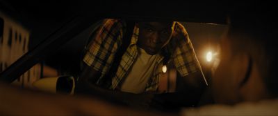 Still from Moonlight (2016) that has been tagged with: 714f38 & night & car interior & over-the-shoulder