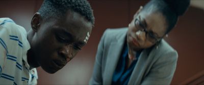 Still from Moonlight (2016) that has been tagged with: 714f38 & low-angle & interior & medium close-up