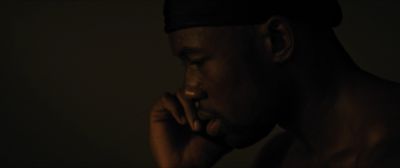 Still from Moonlight (2016) that has been tagged with: 714f38 & phone & interior & close-up