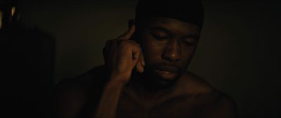 Still from Moonlight (2016) that has been tagged with: night & interior & close-up